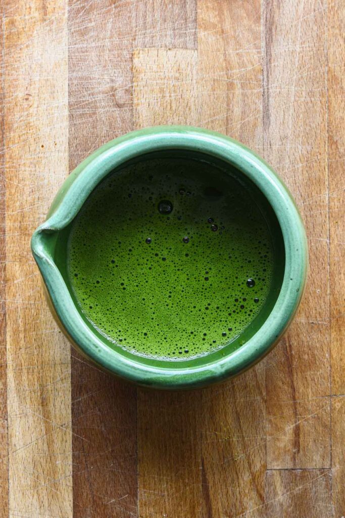 Matcha and water whisked together until frothy.