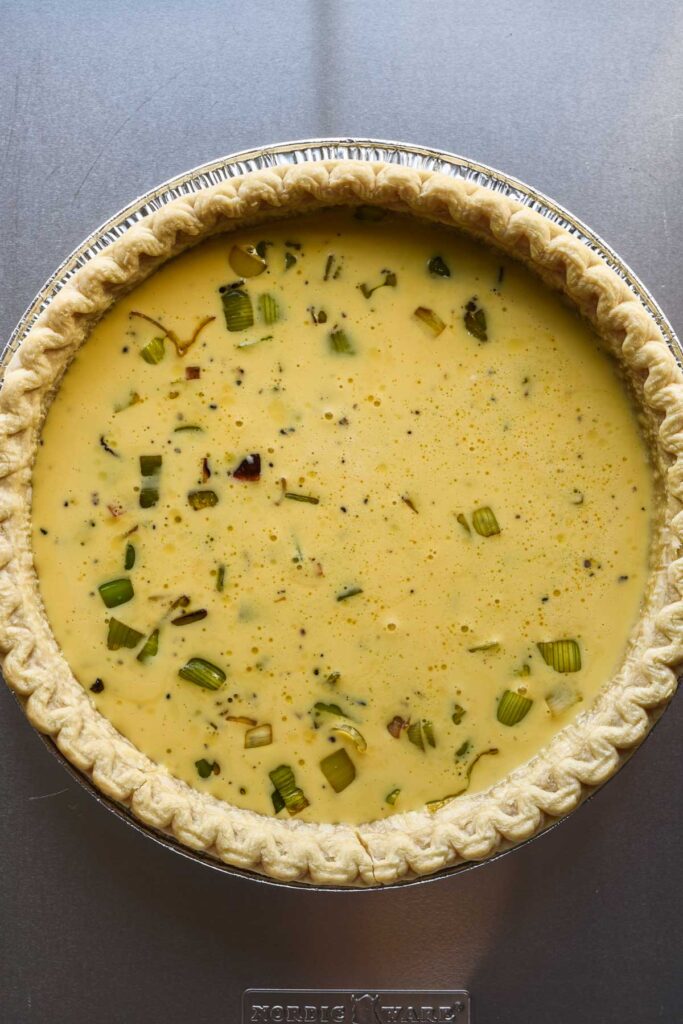 Egg mixture poured on top of leeks.