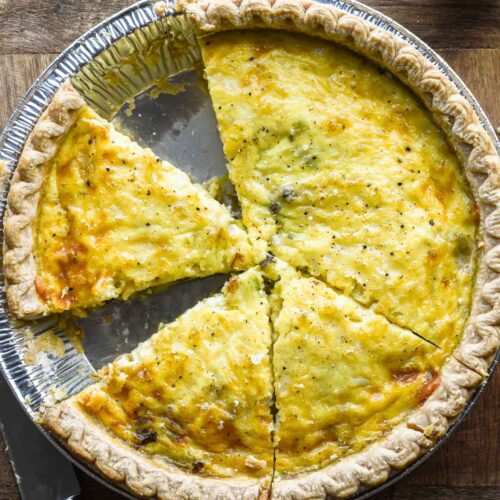 Close up image of sliced leek and gruyere quiche.