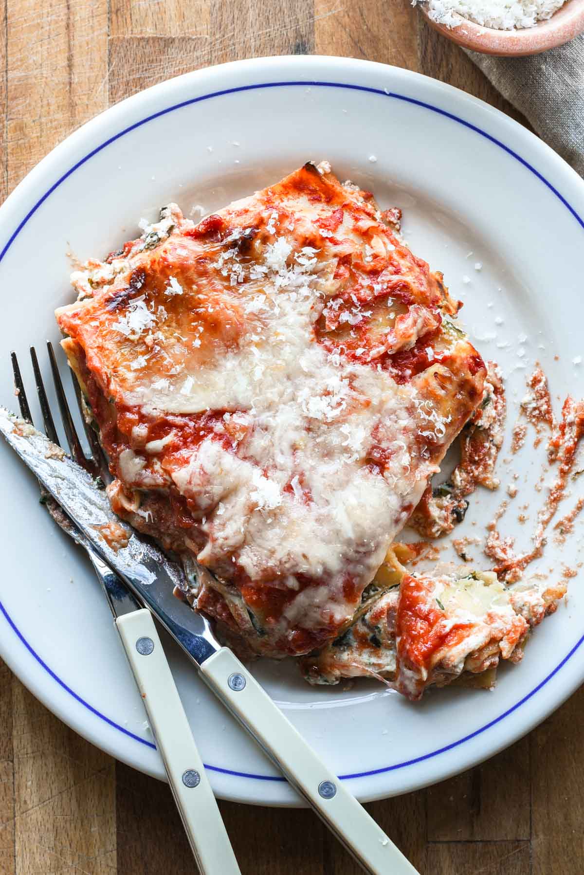 Slice of lasagna on a plate.
