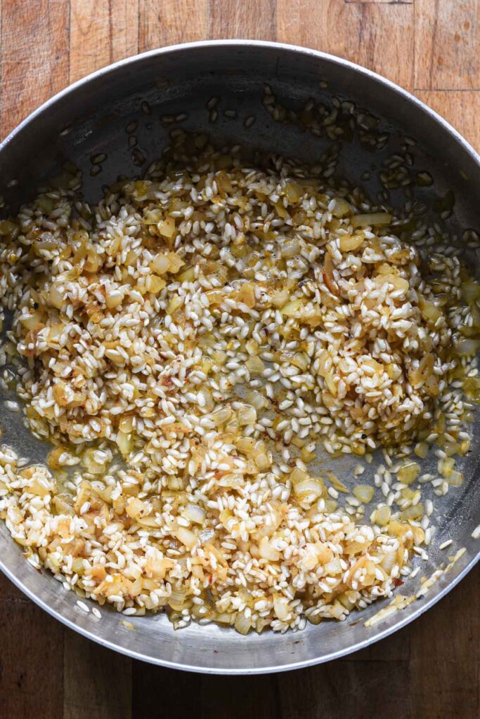 White wine added to deglaze the pan.