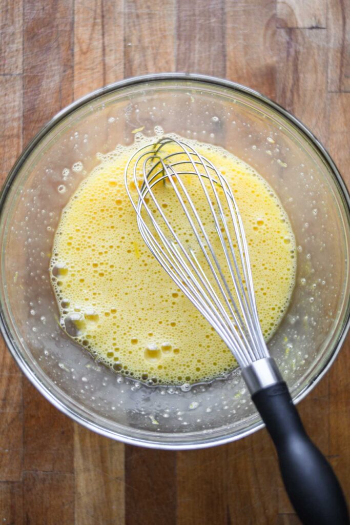 Eggs whisked in with the lemon and sugar.