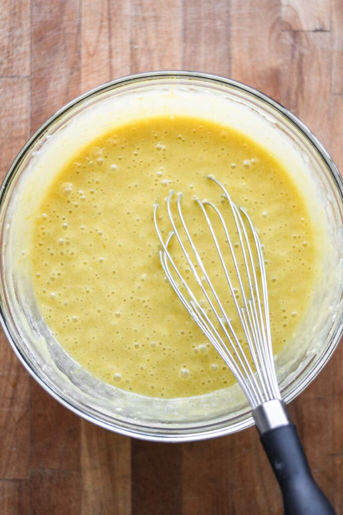 Dry ingredients combined with the wet in a large bowl.