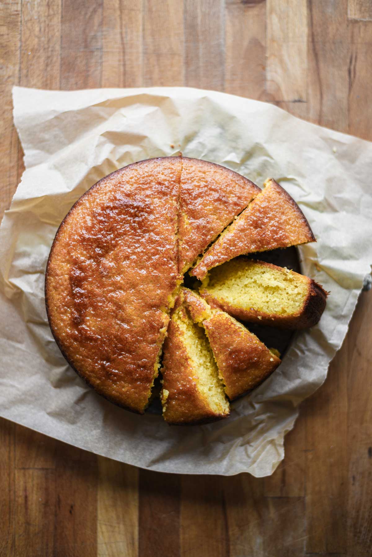 lemon honey cake with slices cut out.