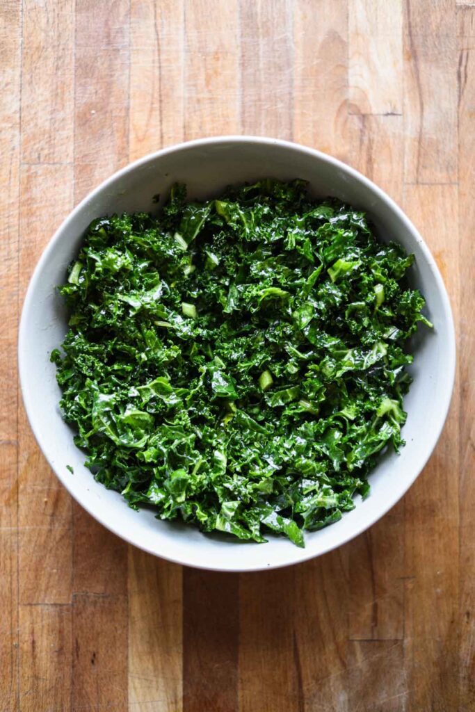 Kale massaged with dressing.
