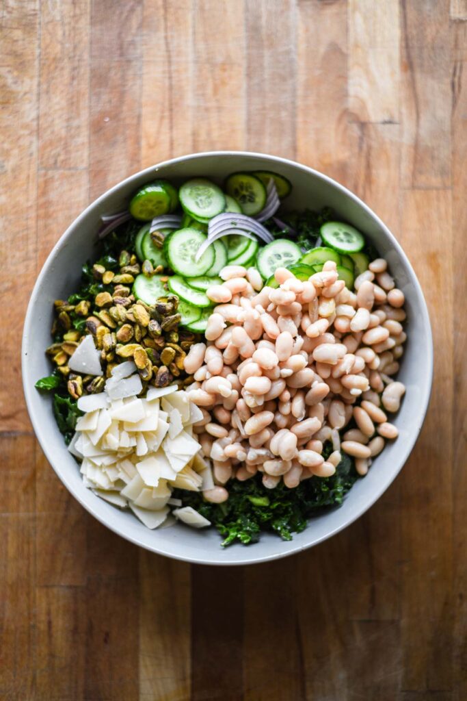 Salad ingredients all in a bowl together.