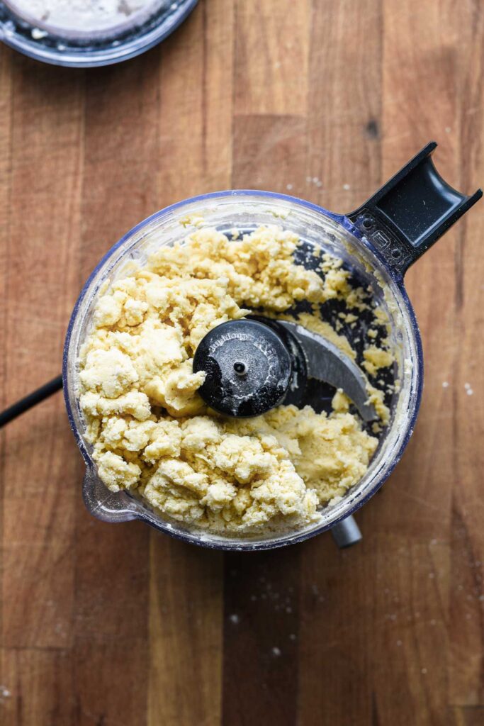 Water added to crust dough to form a ball.