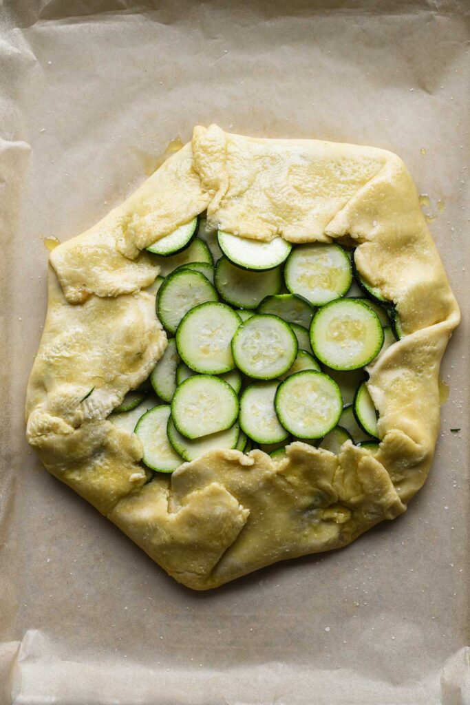 Edges folded up and entire thing drizzled with EVOO.
