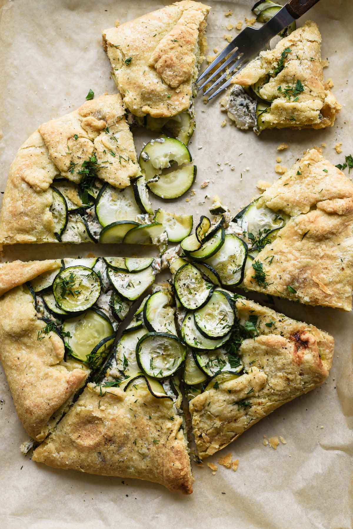 Zucchini ricotta galette being eaten.